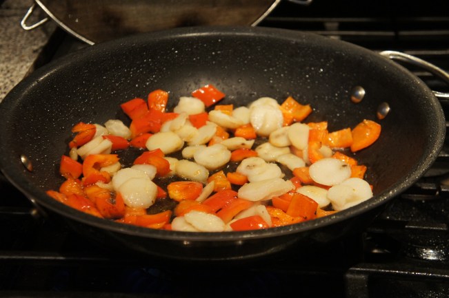 Cook bell pepper and water chestnuts